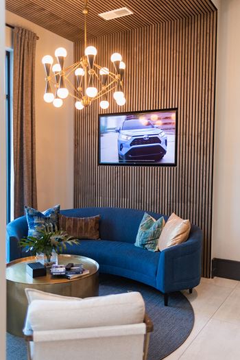A living room with a blue couch 